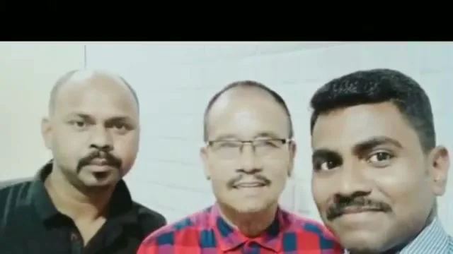 Satish with two men he has helped