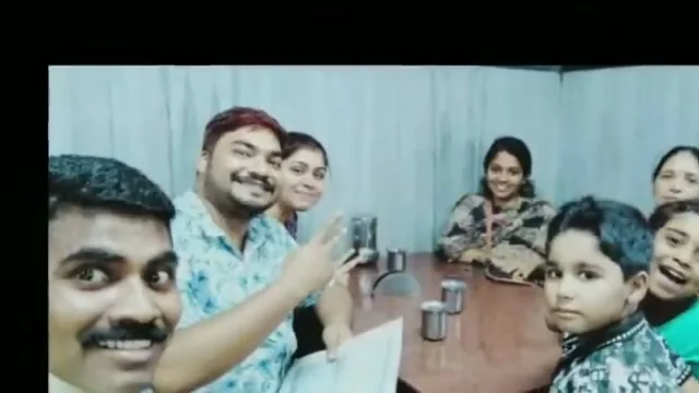 Satish with a family and their children