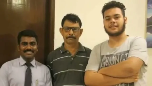Satish standing with two clients